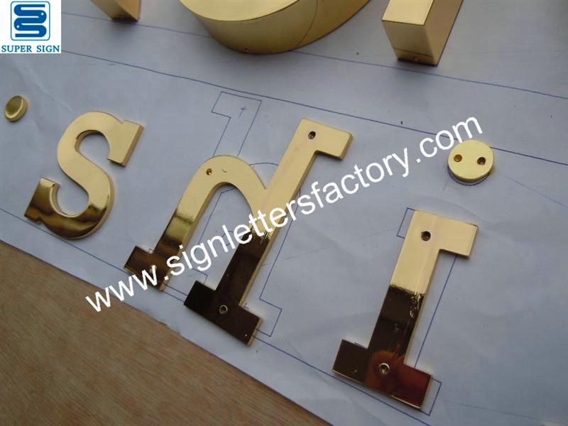 polished brass letter sign